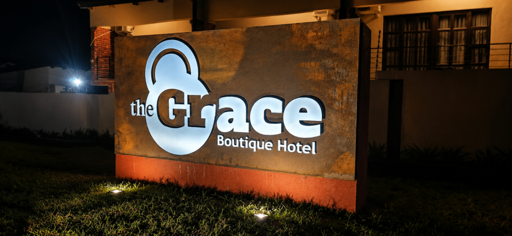 The Grace Boutique Hotel exterior illuminated sign at night