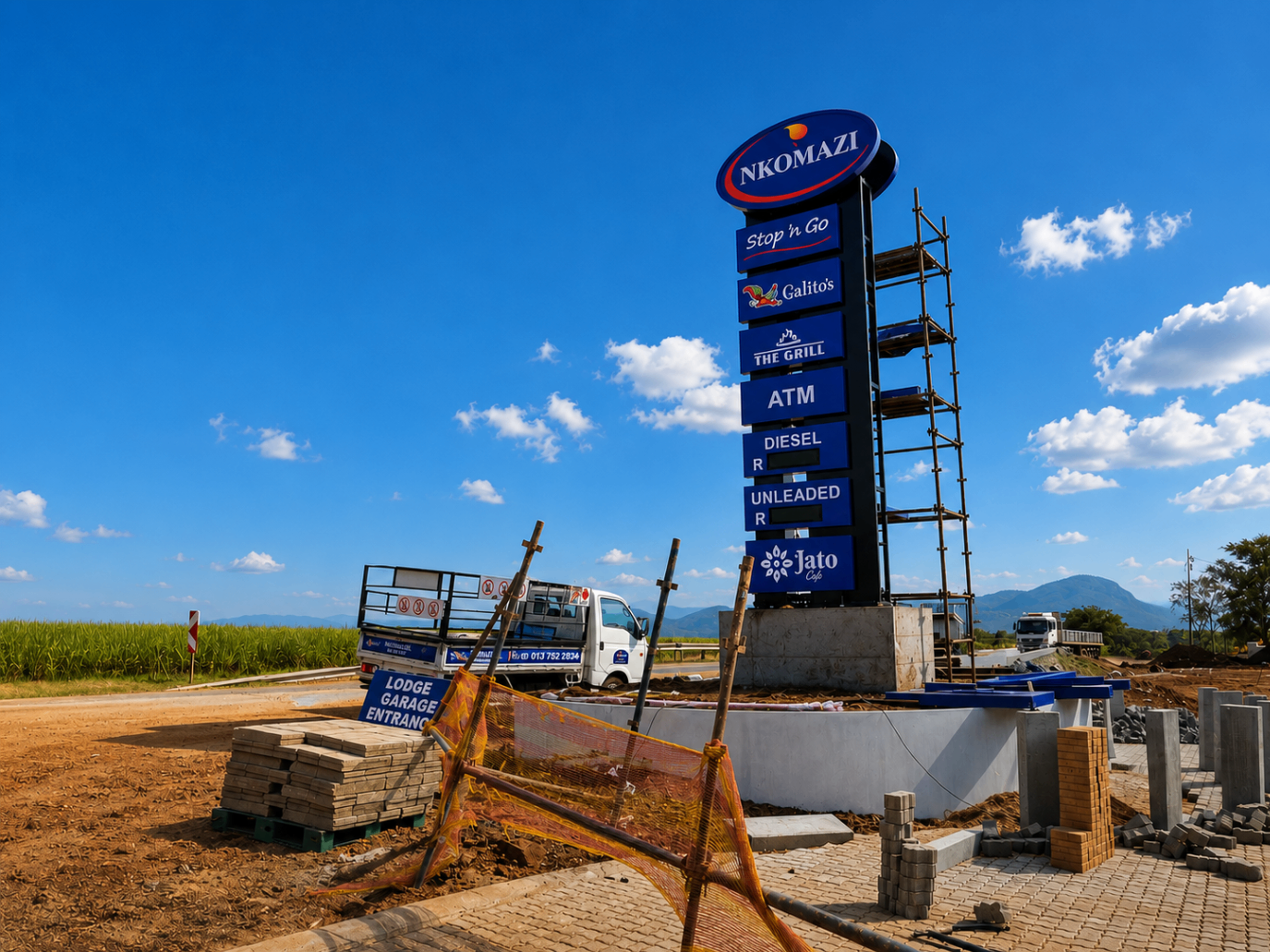Large roadside service station pylon sign installation